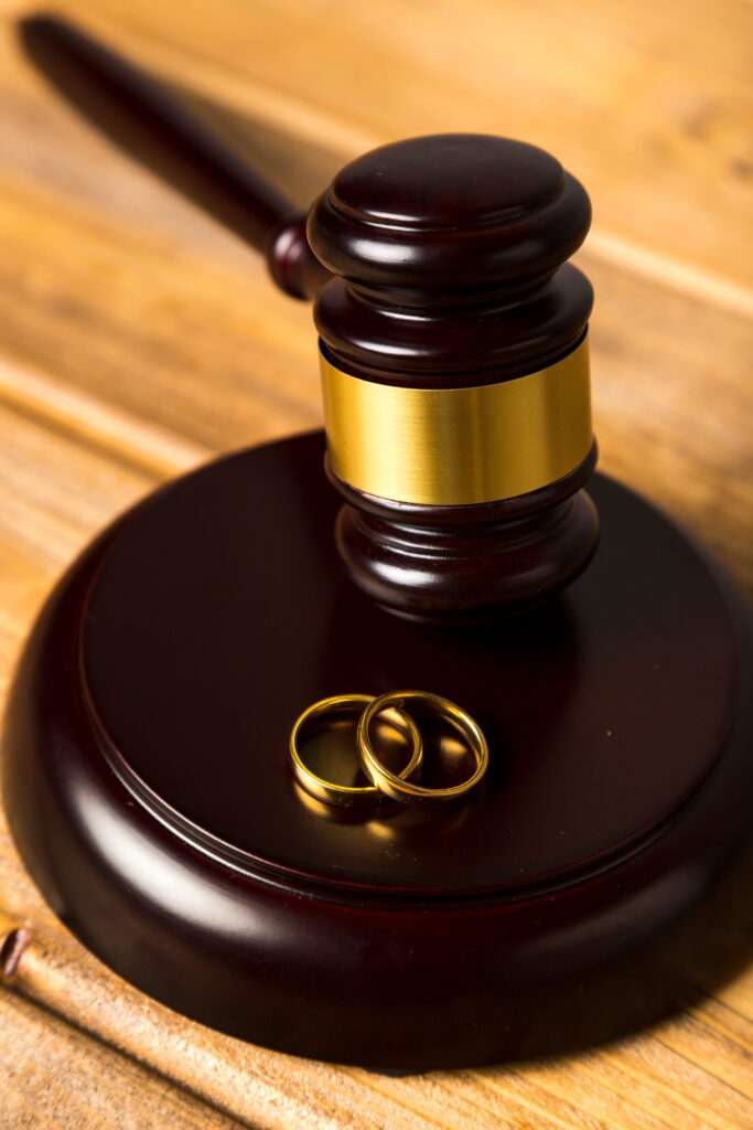 Judge gavel stand with wedding rings